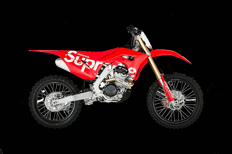 Honda motocross bike in red Supreme livery, a Honda and Supreme brand collaboration