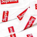 Repeated Supreme box logo on white product packaging, a trademark applied to licensed goods